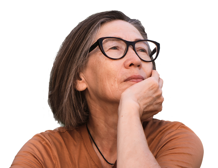 A woman with glasses posing with her hand under her chin looking into the distance